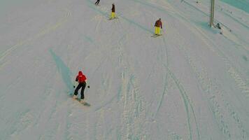 Aerial view of skiers and snowboarders video