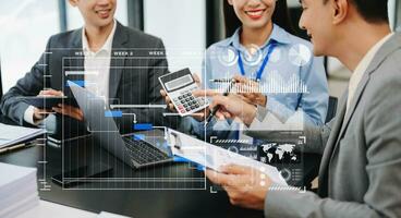 Business team hand Project manager working and update tasks and Gantt chart scheduling virtual diagram.with smart phone, tablet and laptop in office. photo