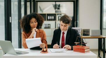 Business and Male lawyer or judge consult having team meeting with client, Law and Legal services concept.Customer service good cooperation in modern office photo