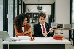 Business and Male lawyer or judge consult having team meeting with client, Law and Legal services concept.Customer service good cooperation in modern office photo