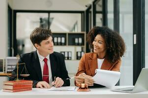 Business and Male lawyer or judge consult having team meeting with client, Law and Legal services concept.Customer service good cooperation in modern office photo