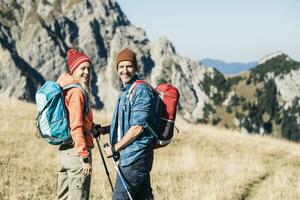 Austria, Tyrol, happy couple on a hiking trip in the mountains photo