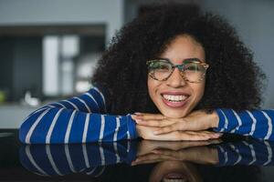 Portrait of happy young woman wearing glasses photo
