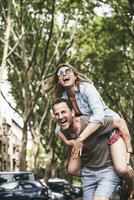 Portrait of carefree couple having fun outdoors photo