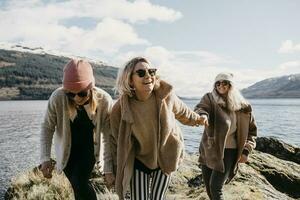 UK, Scotland, happy female friends at Loch Lomond photo