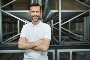 Portrait of smiling man in a factory photo