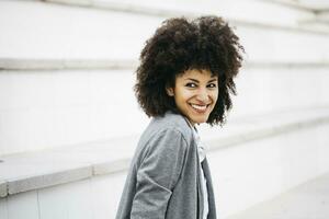 Portrait of laughing woman with curly hair photo