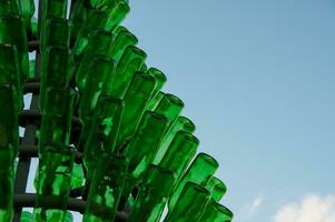Green tree made with glass bottles photo