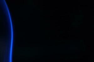 Blue smoke on a dark background photo