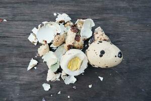 selective focus on quail eggs on wooden table, soft focus photo