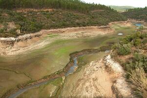 The Ponsul River is a affluent of the Tejo River, in Portugal, and is a very large river. At this time it is completely dry, without water and with its bed cracked due to climate change photo