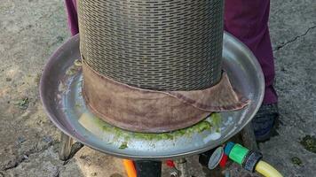 The process of making homemade grape wine. The winemaker opens the hydraulic press to remove the grape pulp after pressing. video