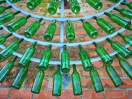 Green tree made with glass bottles photo