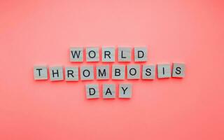 October 13, World Thrombosis Day, minimalistic banner with the inscription in wooden letters photo