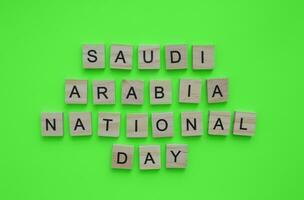 September 23, Saudi Arabia National Day,minimalistic banner with the inscription in wooden letters photo