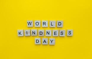 November 13, World Kindness Day, minimalistic banner with the inscription in wooden letters photo