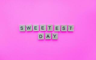 October 21, Sweetest Day, minimalistic banner with the inscription in wooden letters photo