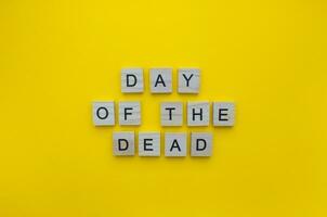 November 1st and 2nd, The day of the Dead, a minimalistic banner with the inscription in wooden letters on an orange background photo