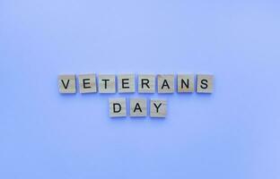 November 11, Veterans day, minimalistic banner with the inscription in wooden letters photo