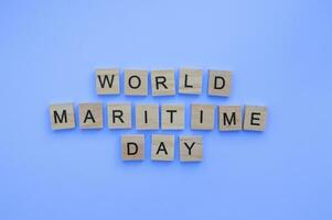 September 28, World Maritime Day, minimalistic banner with the inscription in wooden letters photo
