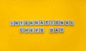 October 20, International chefs day, minimalistic banner with the inscription in wooden letters photo