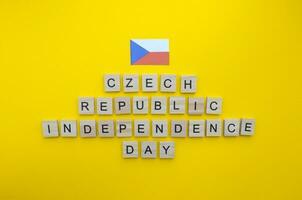 October 28, Independence Day of the Czech Republic, Czech flag, minimalistic banner with wooden letters on an orange background photo