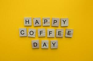 September 29, happy National coffee day, minimalistic banner with the inscription in wooden letters photo