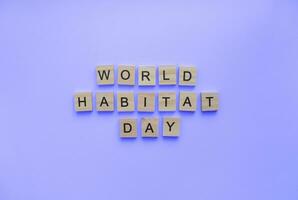 October 2, World Habitat Day, minimalistic banner with the inscription in wooden letters photo