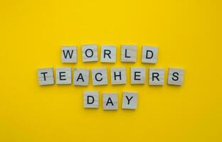 October 5, World Teachers Day, minimalistic banner with the inscription in wooden letters photo