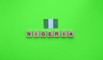October 1, Independence Day in Nigeria, the flag of Nigeria, a minimalistic banner with an inscription in wooden letters photo