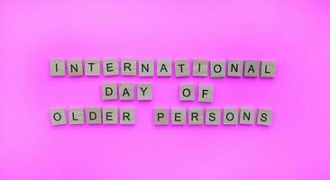 October 1, International Day of Older Persons, minimalistic banner with the inscription in wooden letters photo