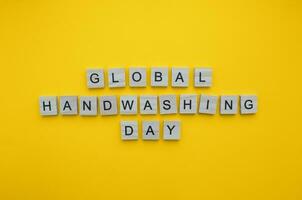October 15, Global Handwashing Day, minimalistic banner with the inscription in wooden letters photo