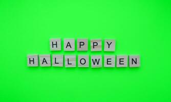 October 31, happy Halloween, minimalistic banner with the inscription in wooden letters photo