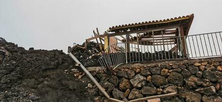 Building destroyed by the volcanic lava flow from the Cumbre Vieja volcano, on the island of La Palma photo