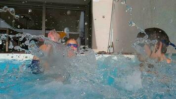 Family splashing water in pool video