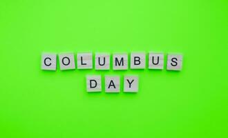 October 9, Columbus Day, minimalistic banner with the inscription in wooden letters photo