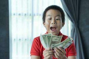 Surprised boy with money photo