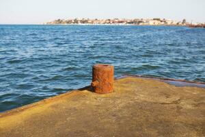 The pier on the sea. the stone pier for fishing photo