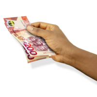 Fair hand holding 3D rendered 200 Ghanaian cedi notes isolated on transparent background png
