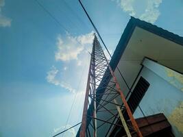 view of tower with buildings against sky background photo