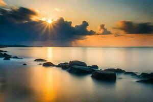 puesta de sol terminado el Oceano con rocas y nubes generado por ai foto