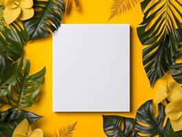 Blank paper with tropical leaves and flowers. Flat lay, top view, copy space photo