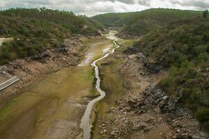 The Ponsul River is a affluent of the Tejo River, in Portugal, and is a very large river. At this time it is completely dry, without water and with its bed cracked due to climate change photo