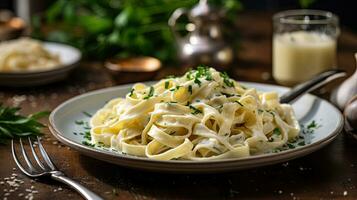 Fettucini Alfredo dinner with creamy white sauce and herbs on table. Generative Ai photo