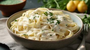 Fettucini Alfredo dinner with creamy white sauce and herbs on table. Generative Ai photo