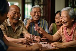 Joyful group of Asian seniors playing cards and sharing laughter in a retirement nursing home. Generative Ai photo