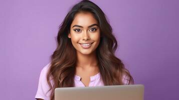 A happy Indian woman with laptop computer working or studying online on lilac background. Generative Ai photo