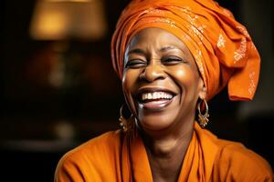 African american woman, joyful middle aged african american woman with orange headscarf. Beautiful black woman in casual clothing with traditional turban at home laughing. Generative Ai photo