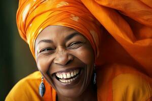 African american woman, joyful middle aged african american woman with orange headscarf. Beautiful black woman in casual clothing with traditional turban at home laughing. Generative Ai photo