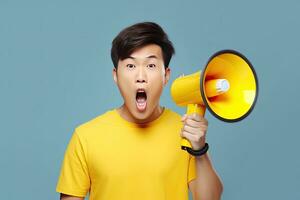 Surprised face of Asian young man wears blue shirt hold scream in megaphone announces discounts sale Hurry up isolated on plain yellow background. Generative Ai photo